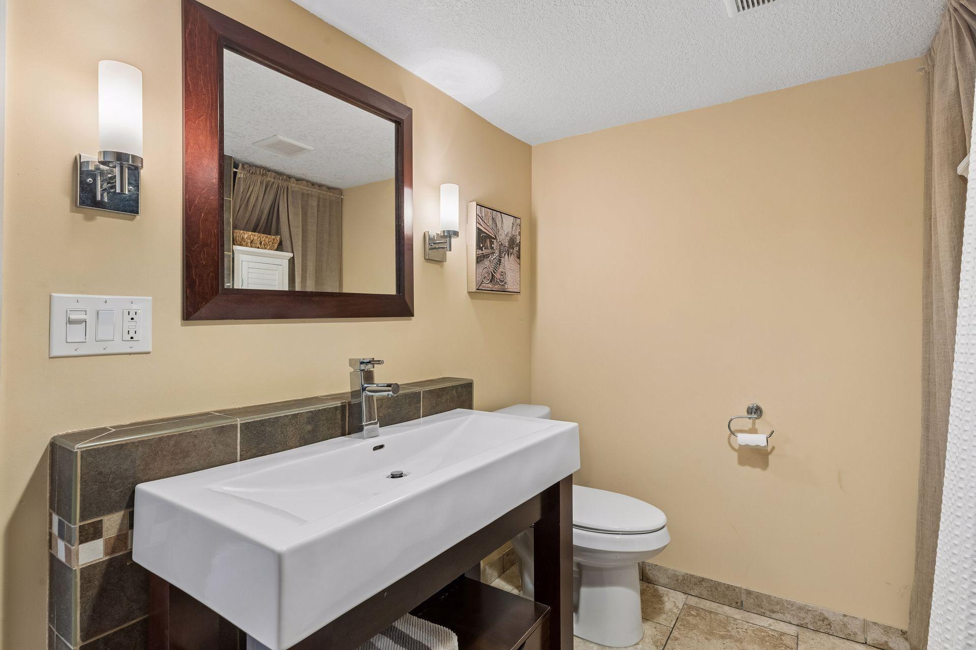 Contemporary sink with storage below.
