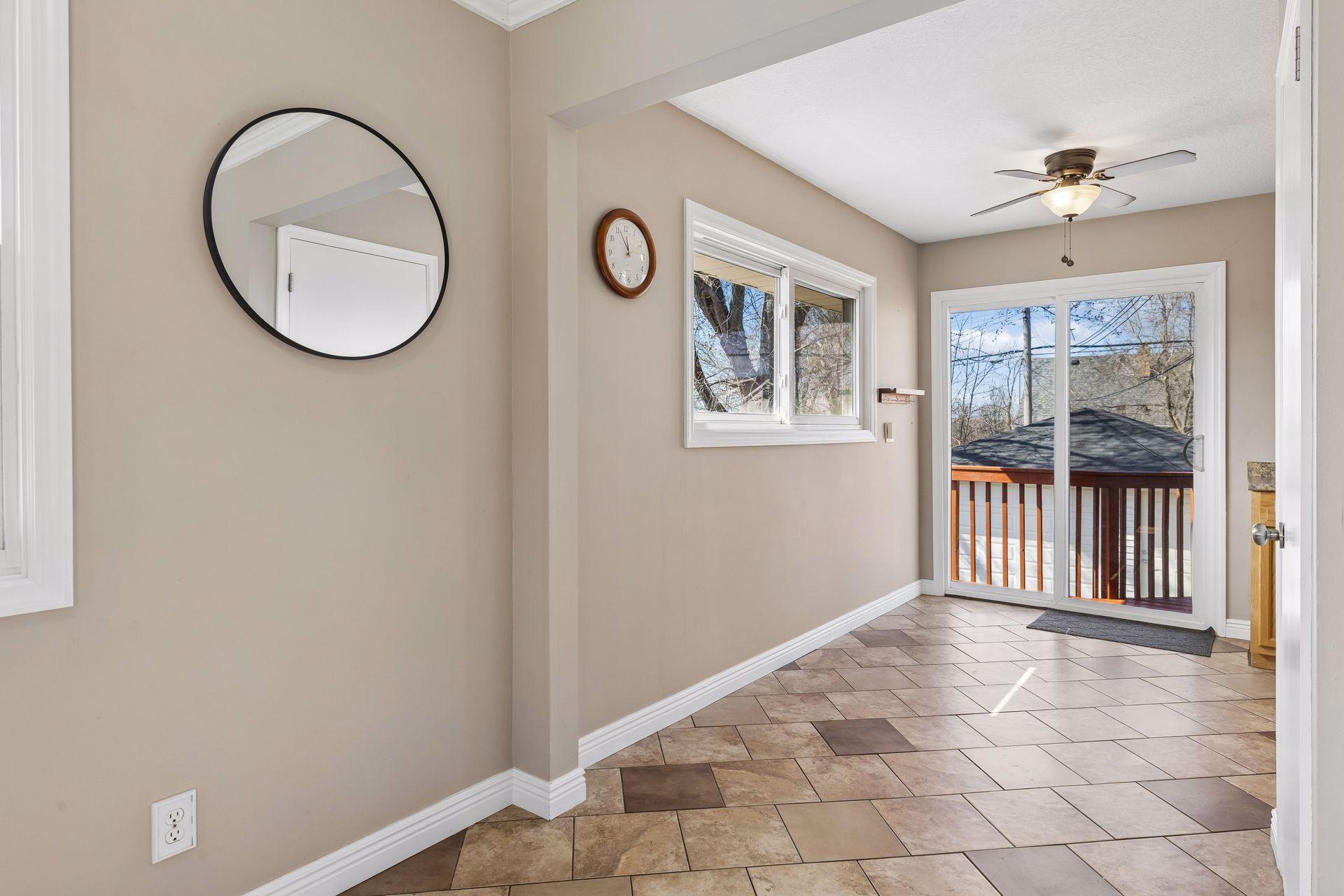 Casual dining area off the kitchen featuring deck access, ideal for everyday meals and seamless outdoor entertaining.