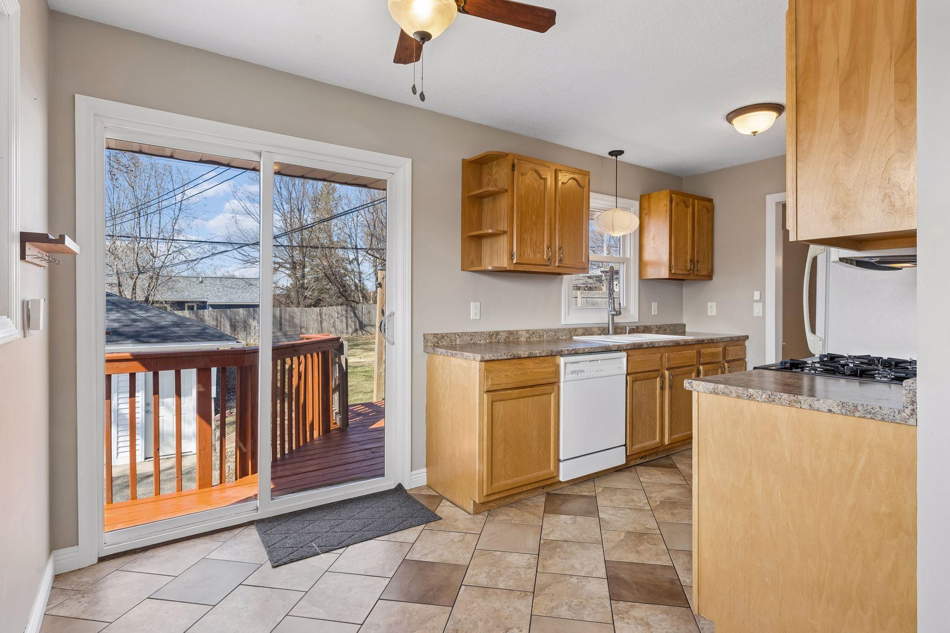 Kitchen with great storage and direct deck access—perfect for easy entertaining.