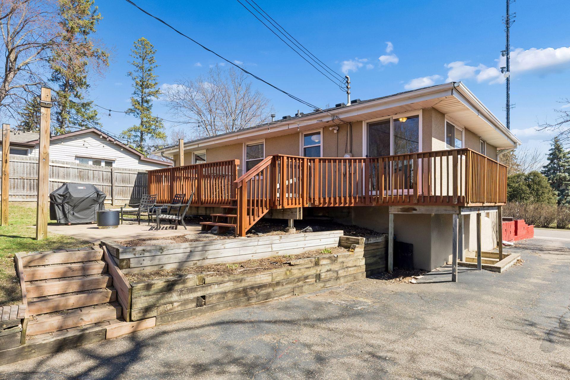 Expansive deck overlooking the backyard—perfect for outdoor dining, relaxing, and entertaining.