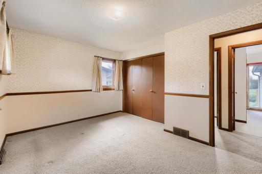 Bedroom 2 empty- Hardwood flooring under carpet