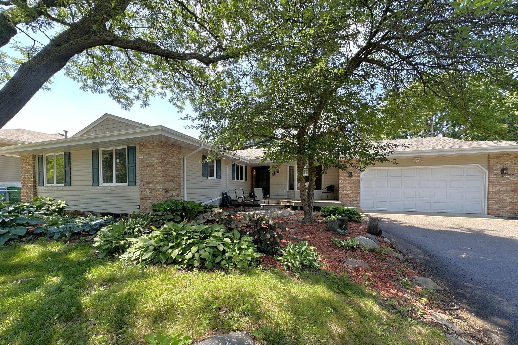Street view of this versatile large home in the St Anthony-New Brighton school district.
