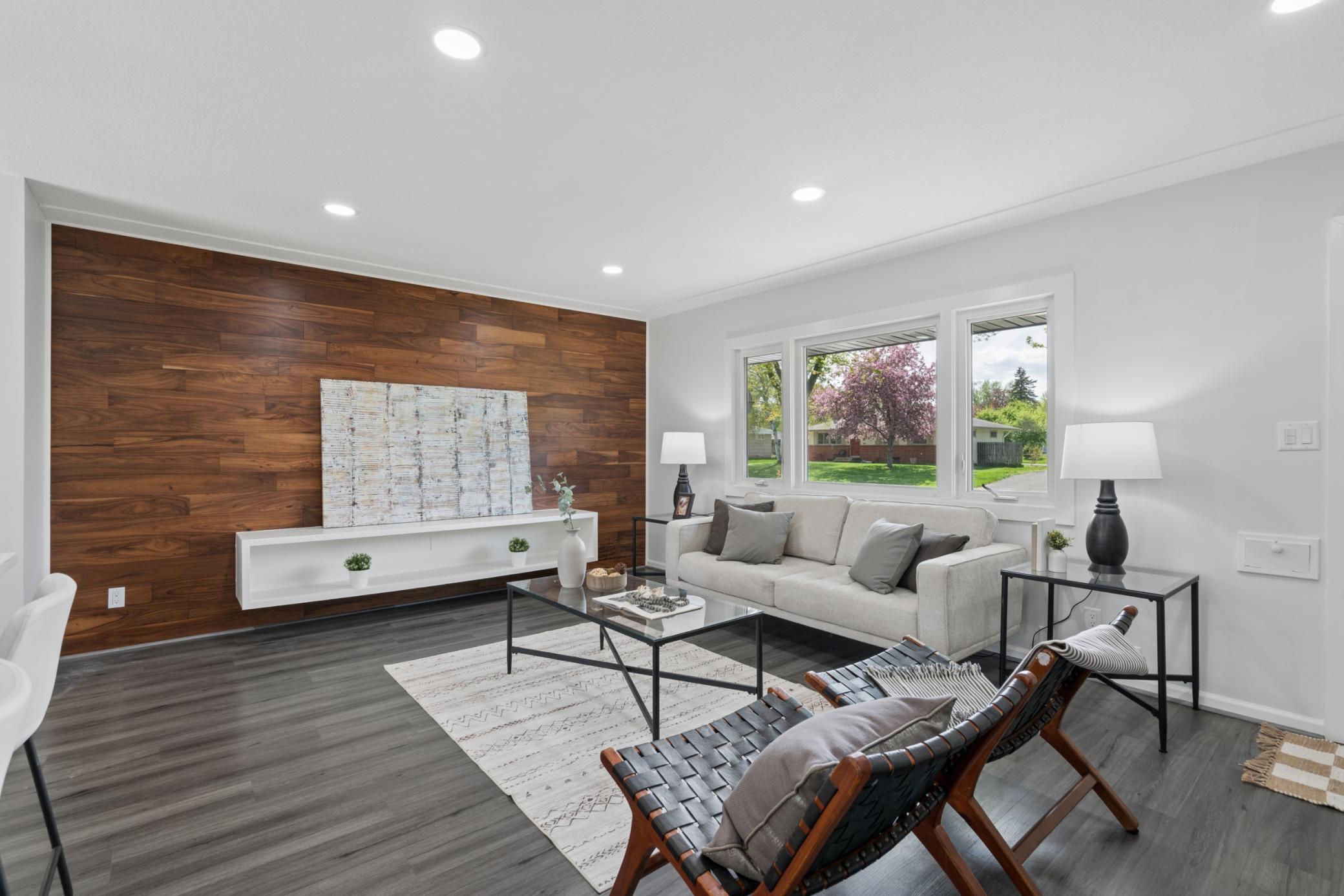 Bright Living Room with accent wall and recessed lighting
