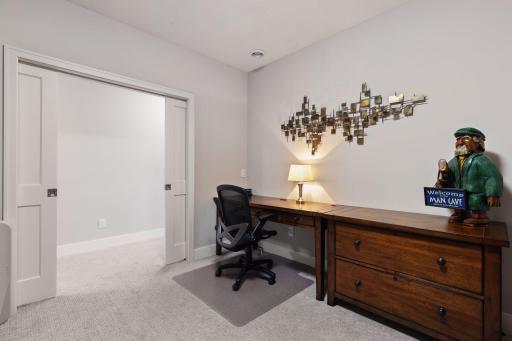 Lower level Exercise Room/Den wwith solid pocket doors located in the lower level