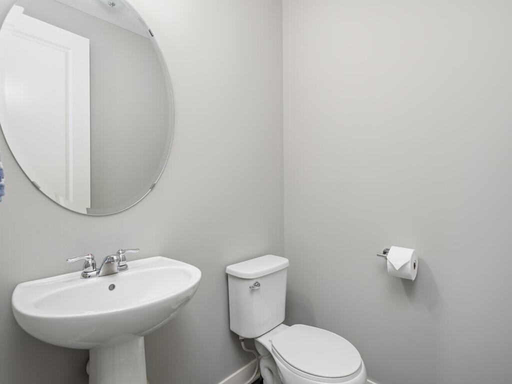 Main-level 1/2 bath with clean, functional layout.