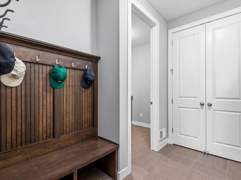 Mudroom with built-in bench, hooks, and convenient storage.