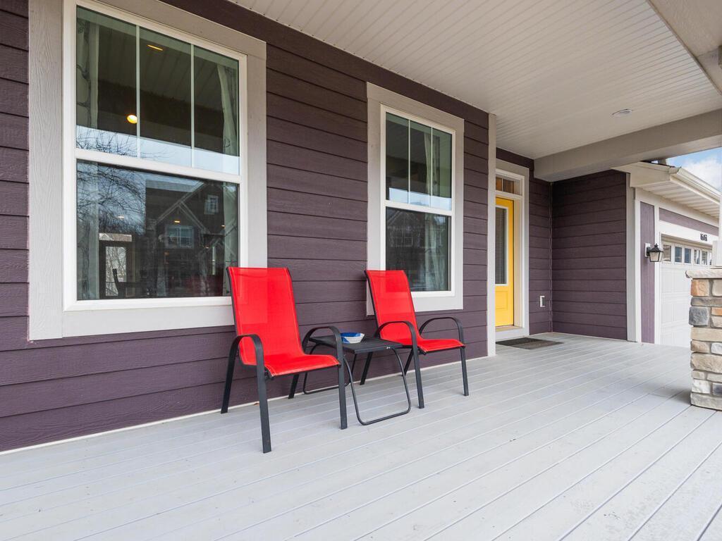 Welcoming front porch seating area with views of the neighborhood.