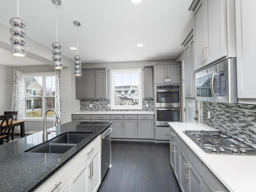 Bright kitchen workspace with window views and generous counter space.
