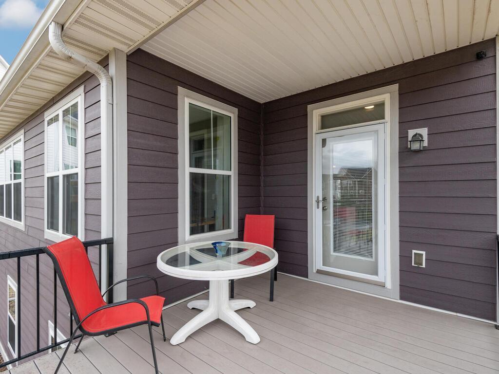 Covered deck area with easy access from the kitchen, great for outdoor dining.
