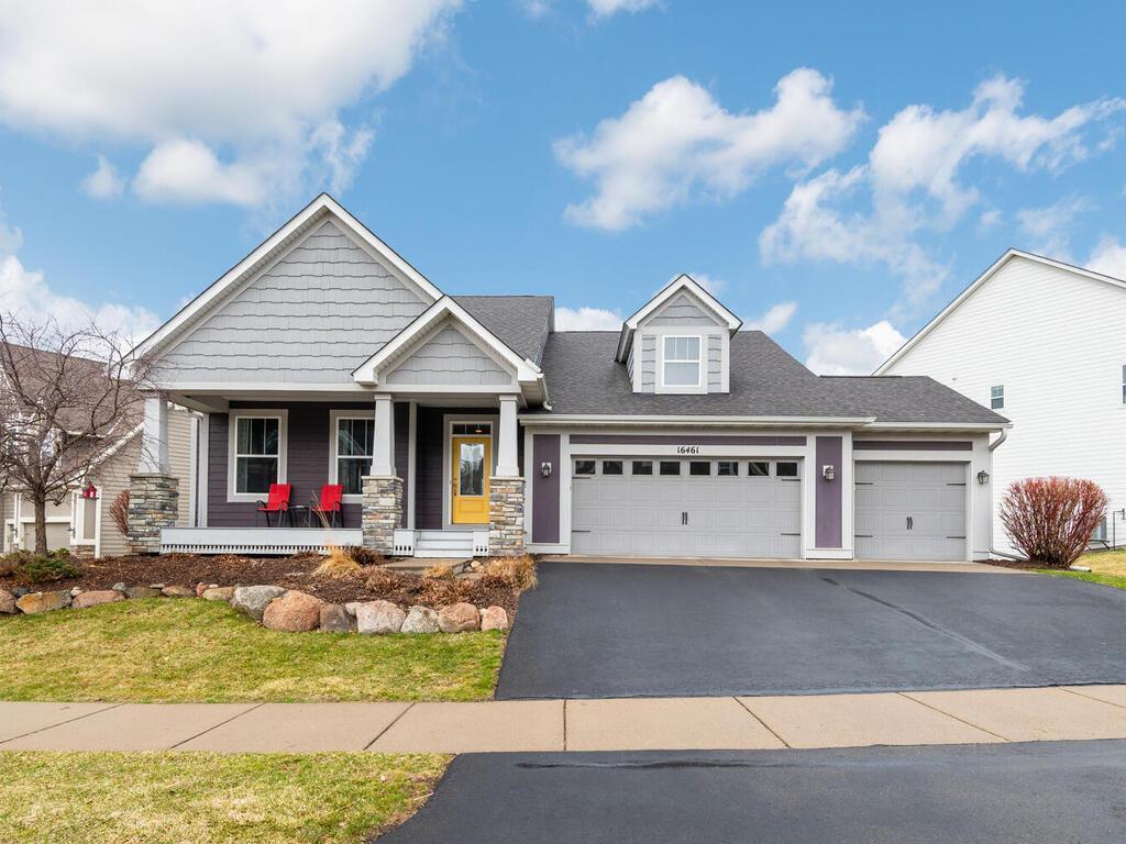 Spacious three-car garage with wide driveway and well-maintained exterior.