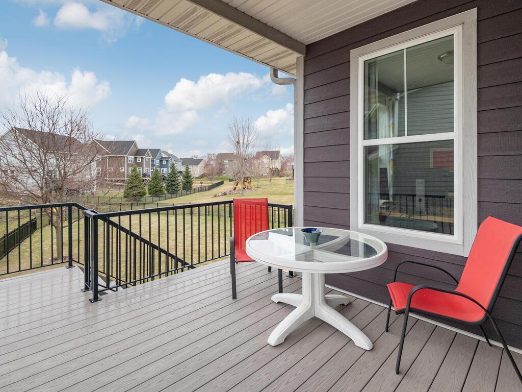Maintenance-free deck with space for seating and views of the backyard.