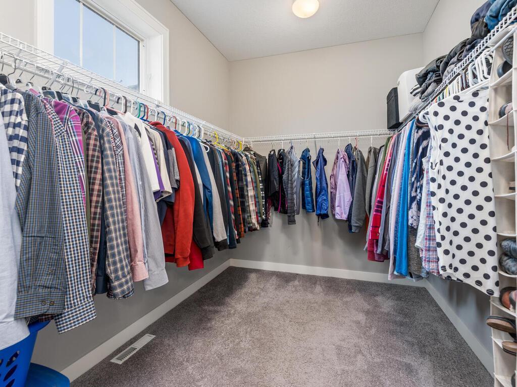 Large walk-in closet with ample hanging space and organization.