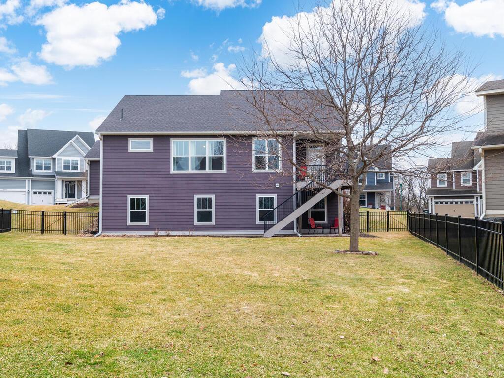 Expansive backyard with open green space and privacy fencing.