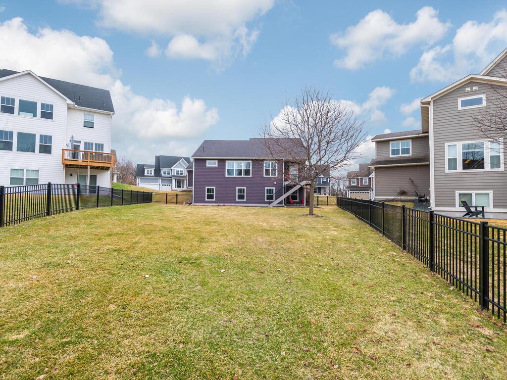 Fully fenced backyard offering space to play, relax, or entertain.