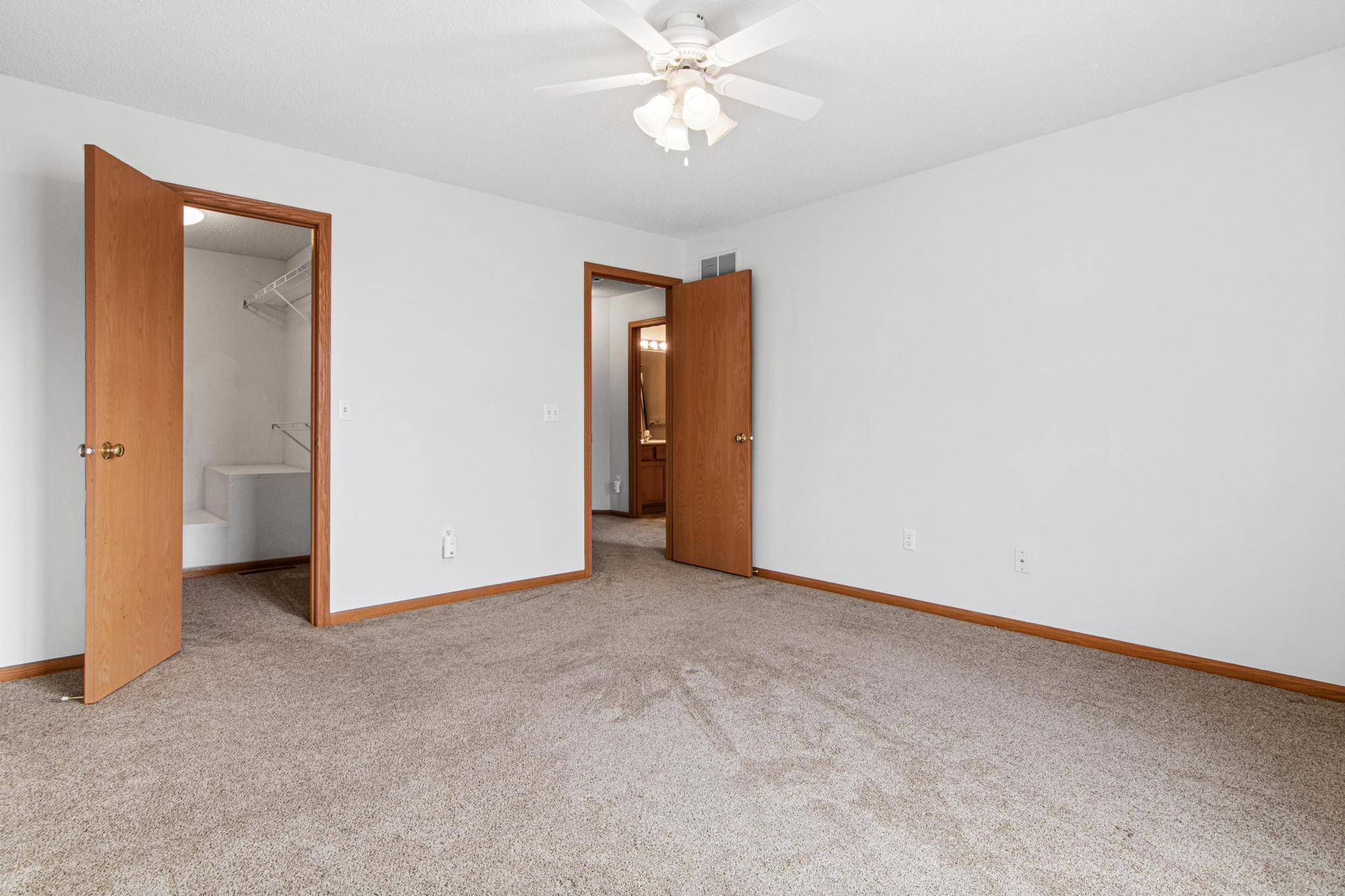 Primary bedroom with walkin closet