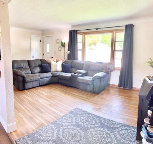 Another Living room view with nice hardwood floors and nice window for natural light