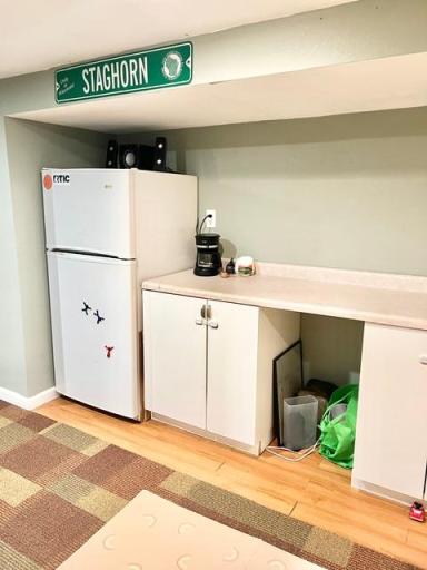 Play/craft room with counter and space for a fridge