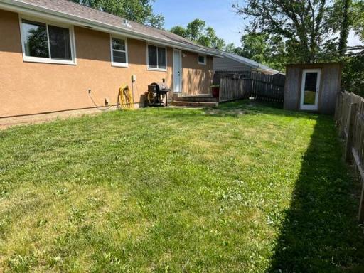 Large back yard with storage shedBack yard