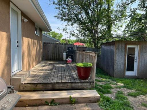 Deck with new door to the garage and shed