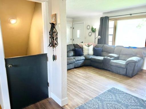 Another view of the Living room with stairway to the basement