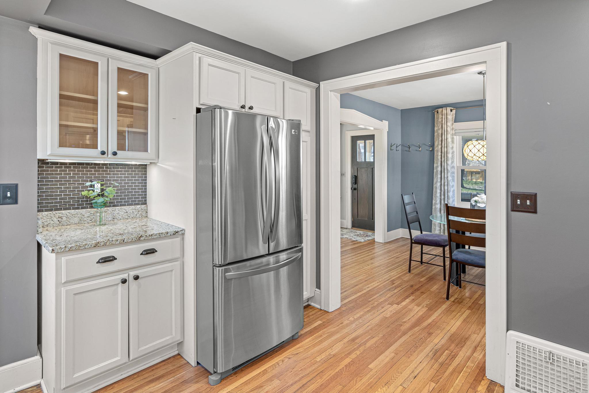 Abundant cabinetry and generous counter space- a chef's delight.