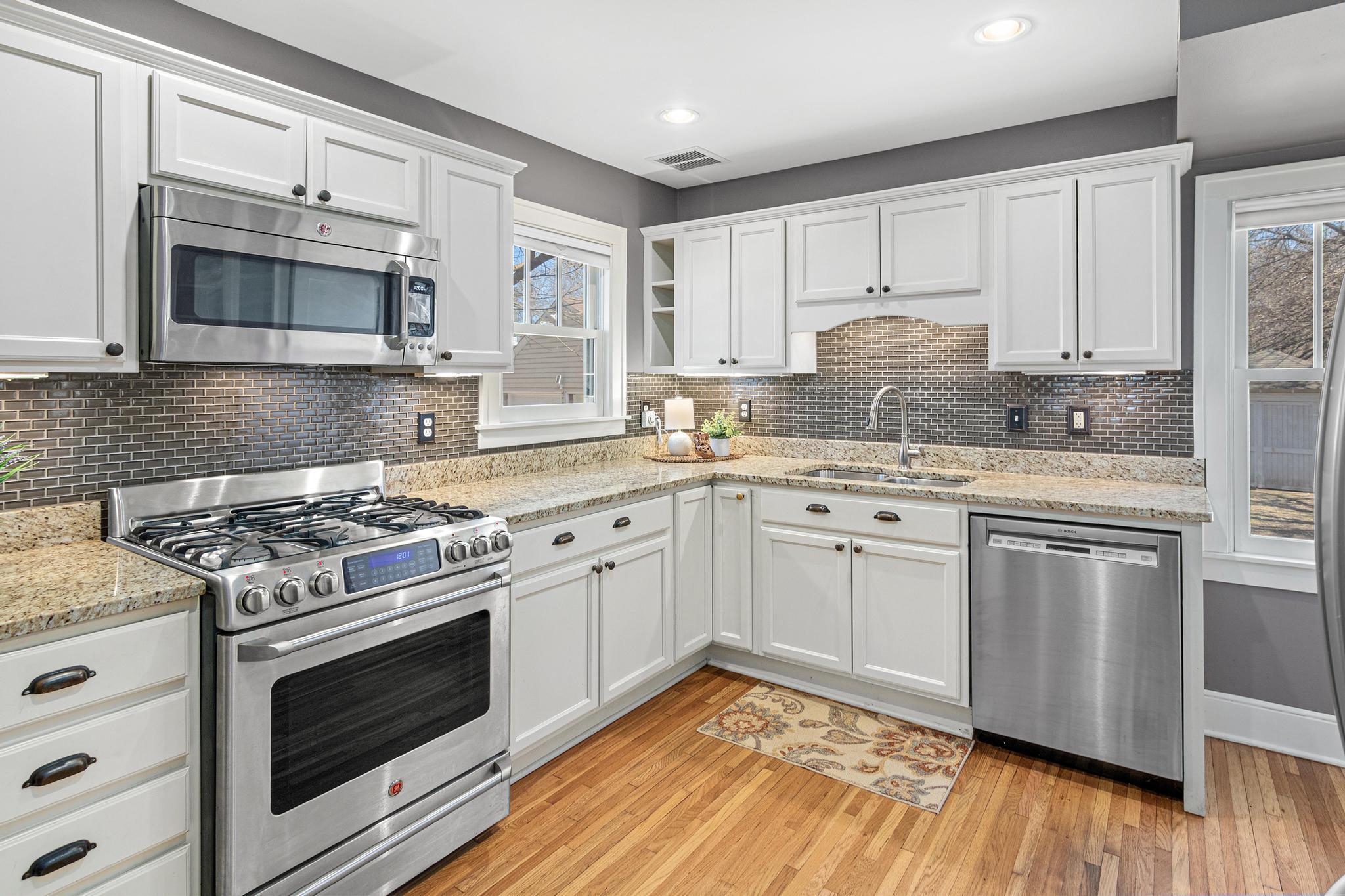 Updated kitchen with high-end stainless-steel appliances.