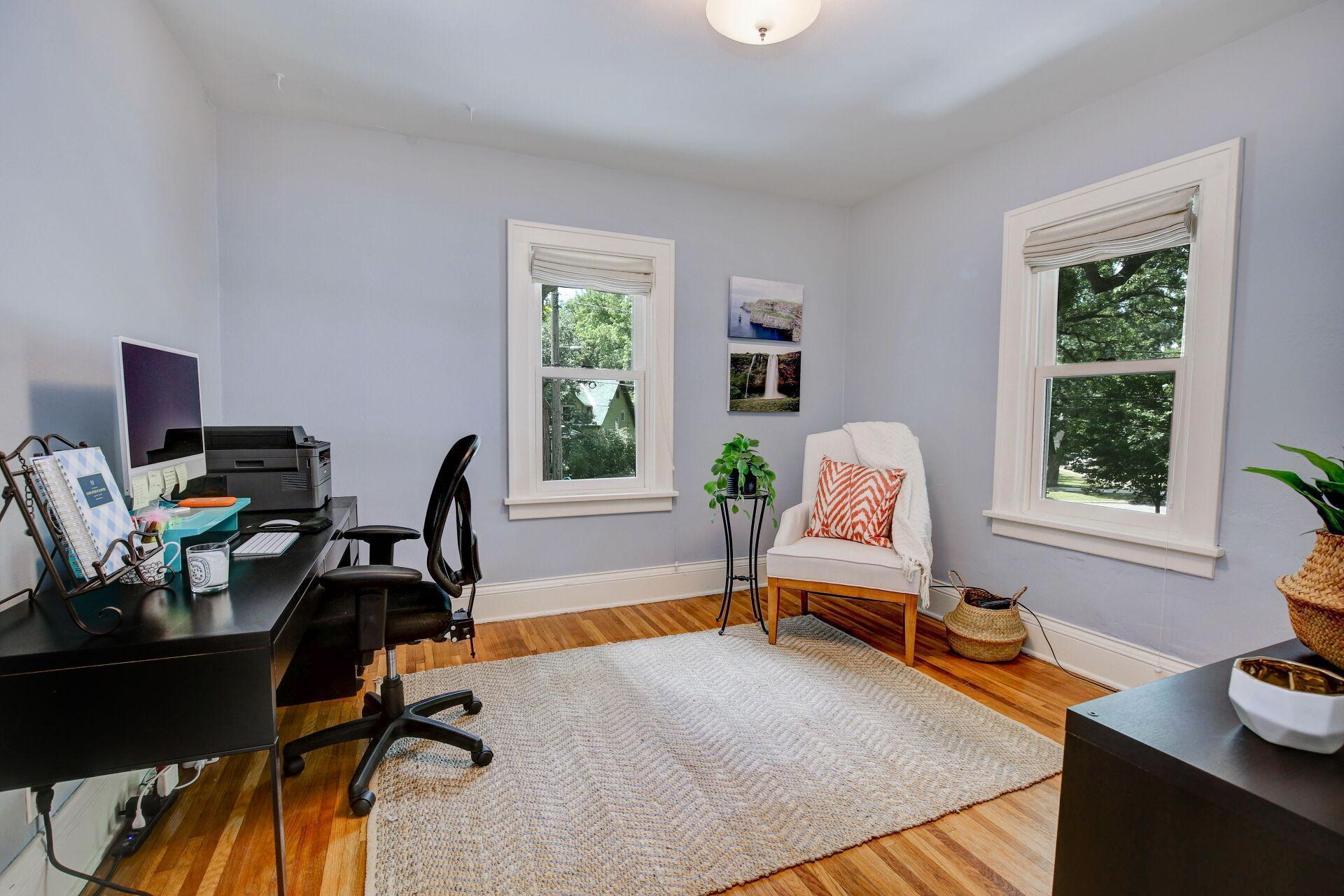Second bedroom visually staged as an office.