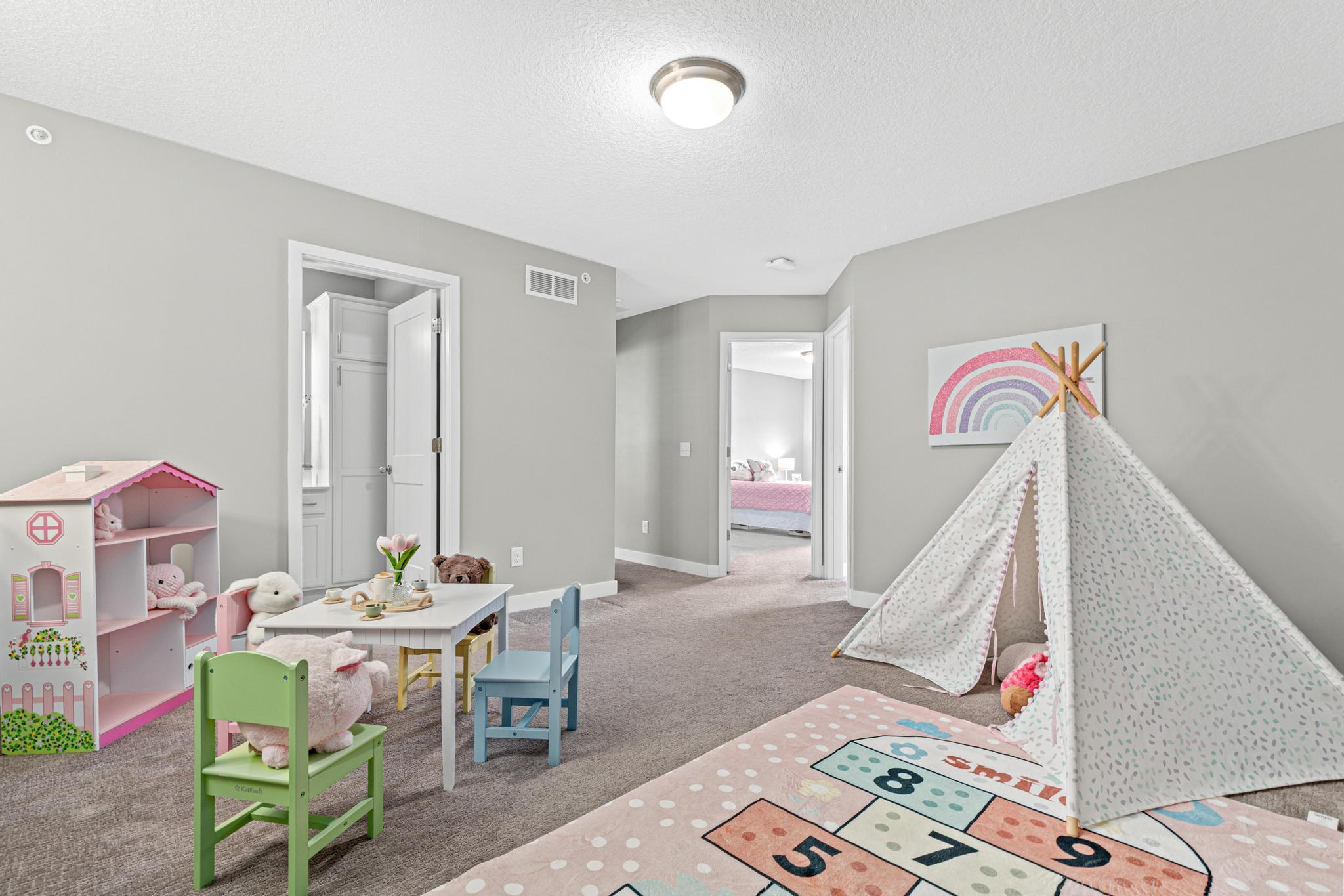 Versatile upper-level loft offers a flexible secondary living space for an office or media room. This multi-functional landing separates the primary suite from guest bedrooms and provides convenient, central access to the full upper-level bathroom.