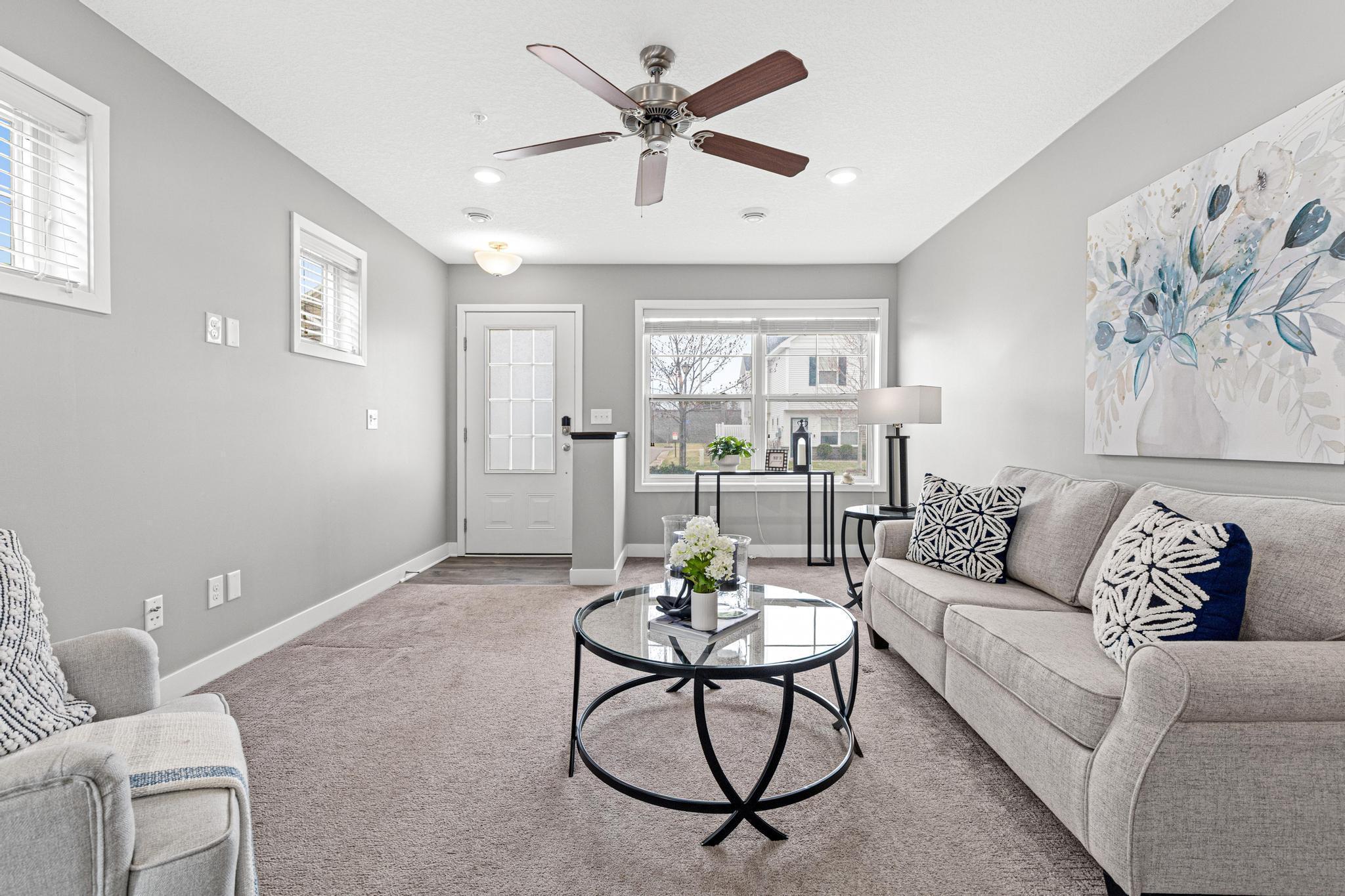 This view from the kitchen shows off the open floor plan and the incredible natural light that fills the home thanks to its end-unit position.
