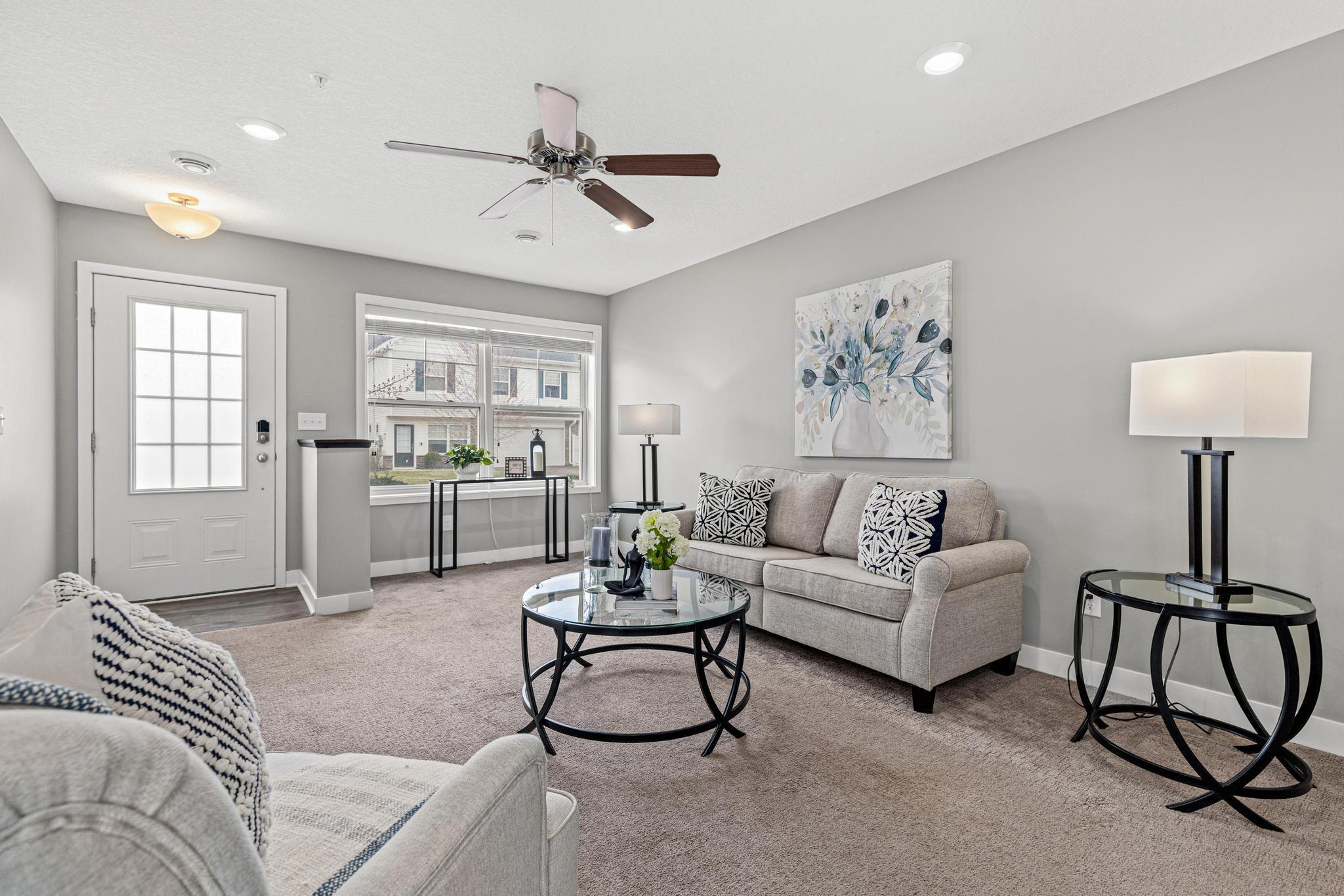This view from the kitchen shows off the open floor plan and the incredible natural light that fills the home thanks to its end-unit position.