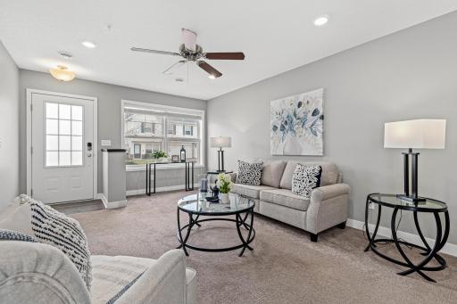 This view from the kitchen shows off the open floor plan and the incredible natural light that fills the home thanks to its end-unit position.