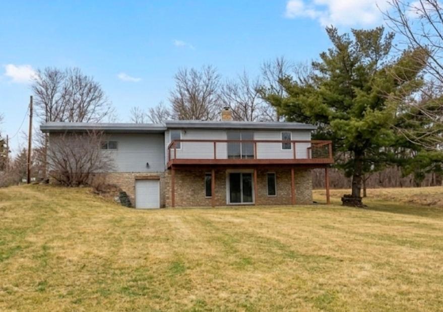 Enjoy the back deck with views of West Rush Lake and the channel that gives you access to the lake.