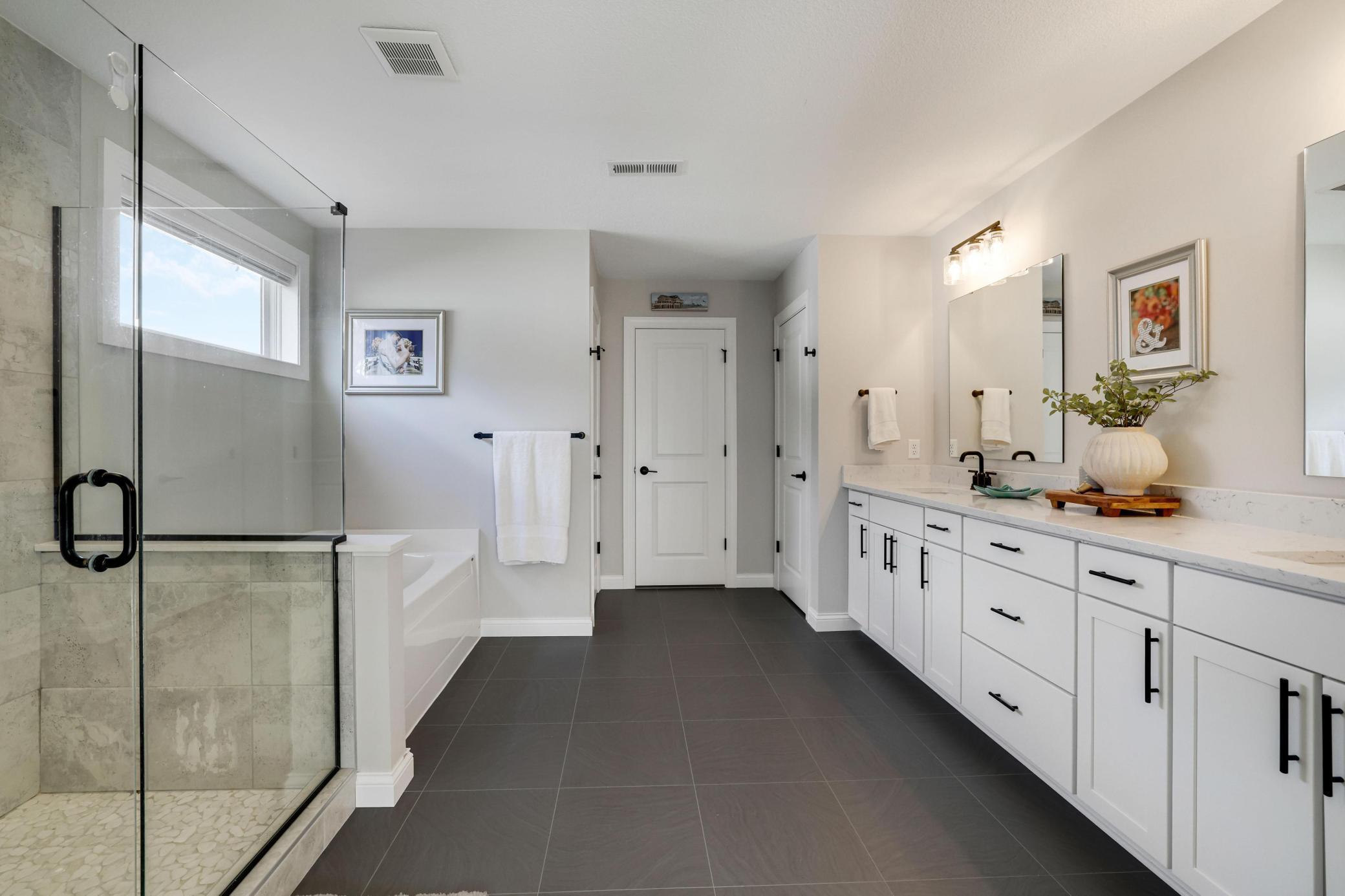 Huge master bath with a large dual vanity, and separate soaker tub and shower