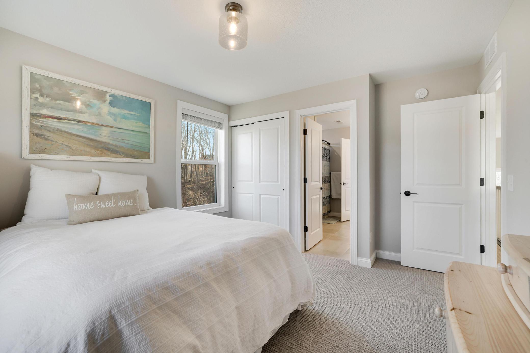 Upper level front bedroom with shared full bath
