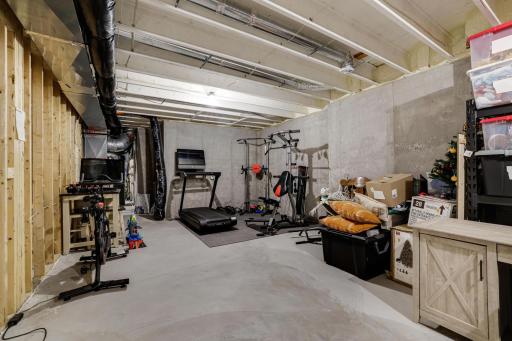 LOTS of unfinished storage space that can double as a workout area or home gym space
