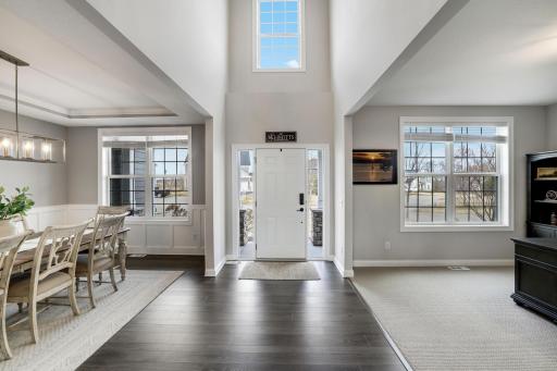 Grand 2-story foyer with hardwood flooring brings in lots of natural light