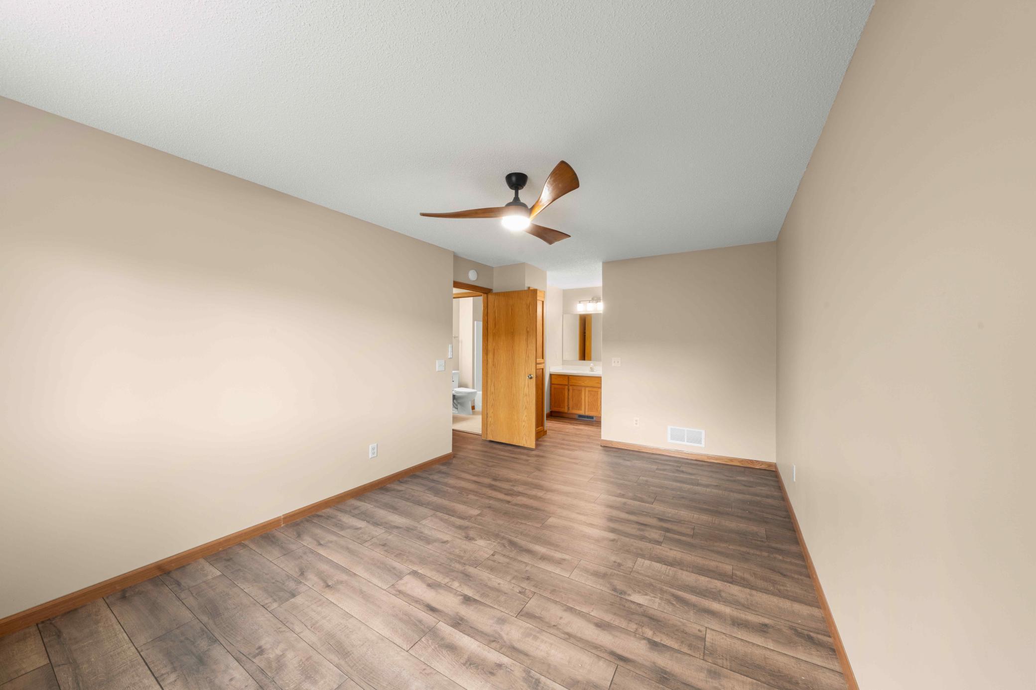 Owner's suite with private vanity, walk-in closet and walk-through bathroom