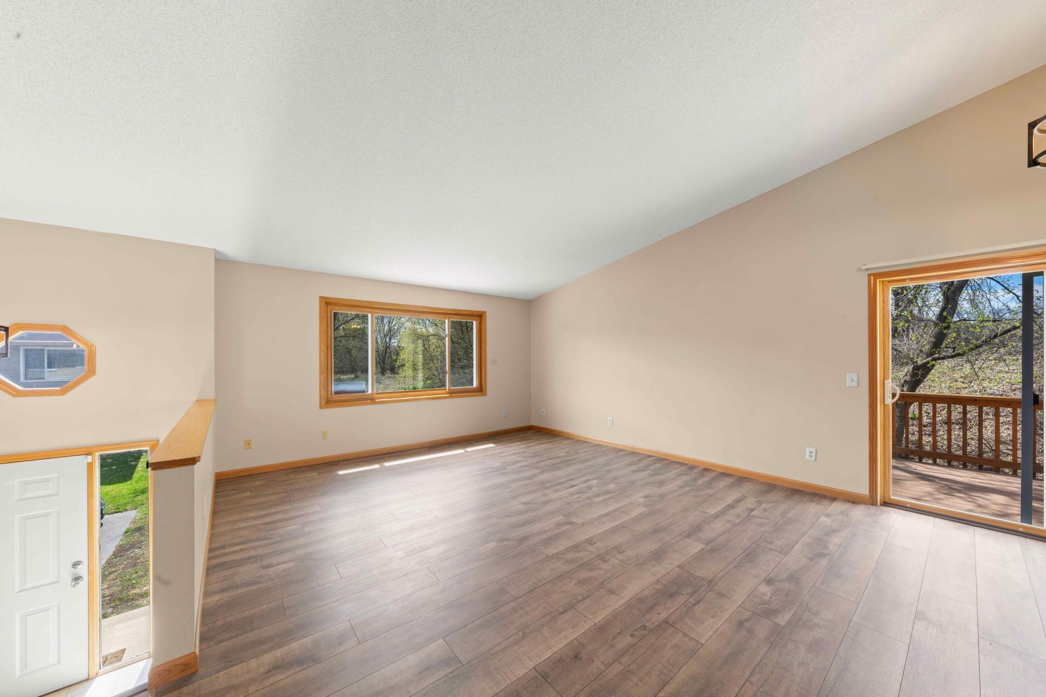 Lots of natural sunlight and newer LVP flooring on upper level