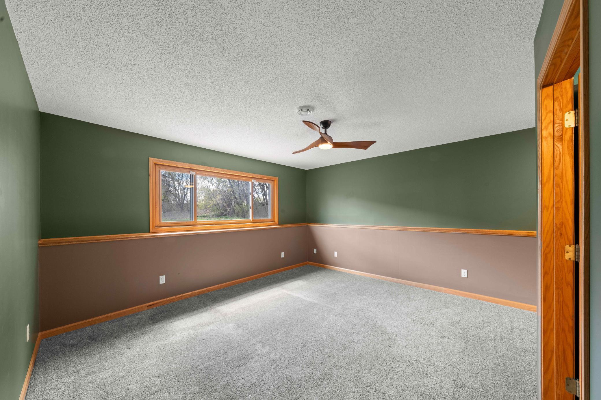 Lower level family room. Great for movie nights to sit back and relax