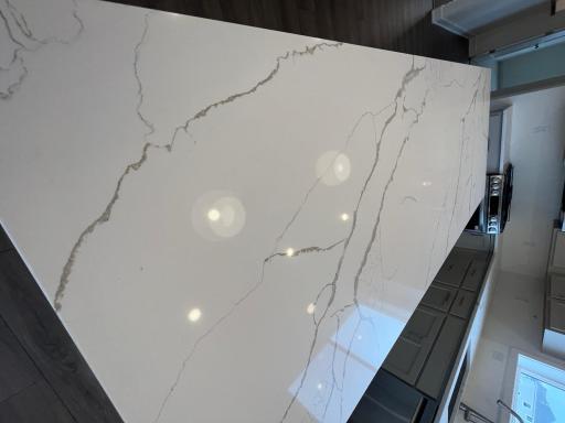 Quartz countertops in kitchen with marble-like veining