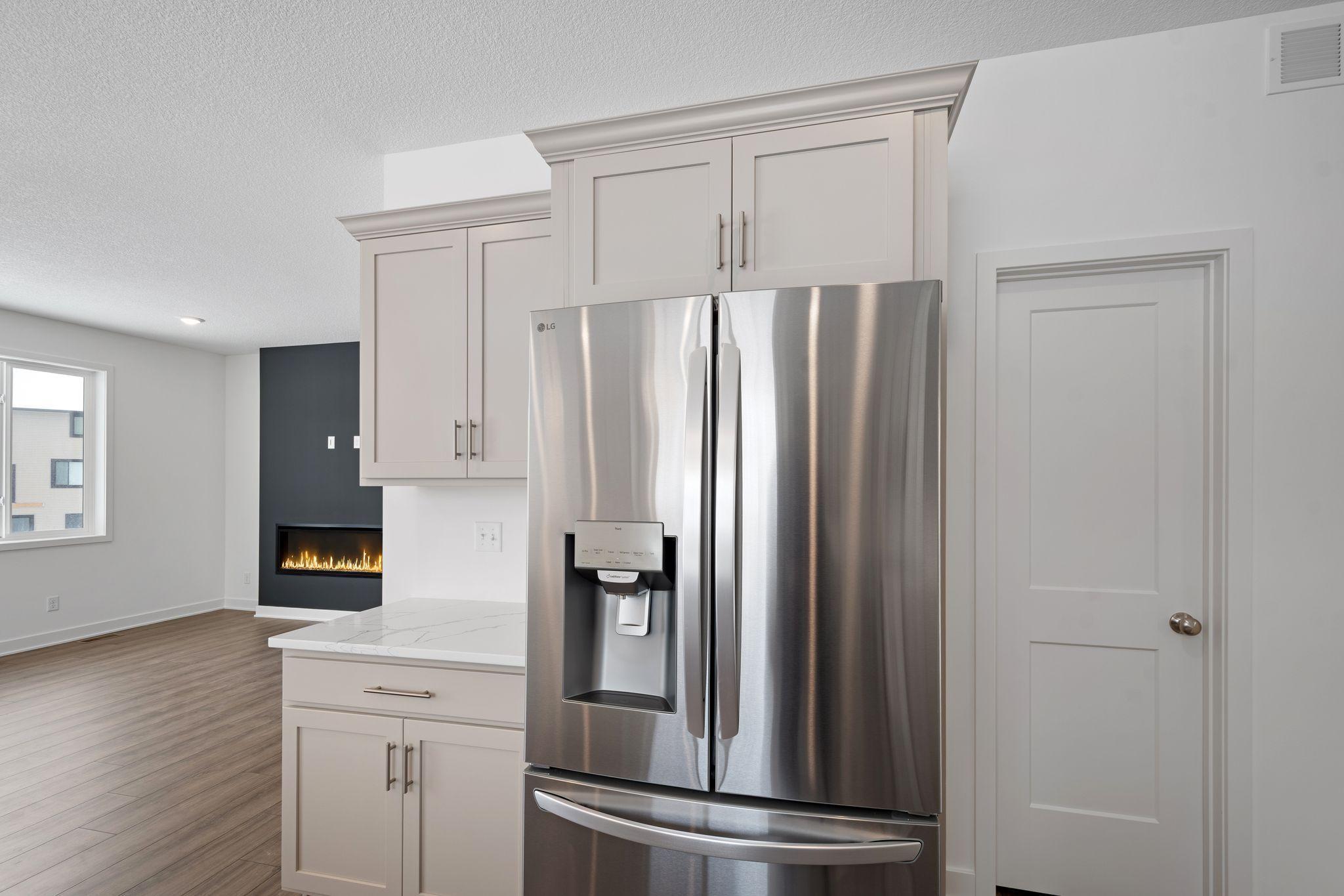 French-door refrigerator next to generously sized walk-in pantry