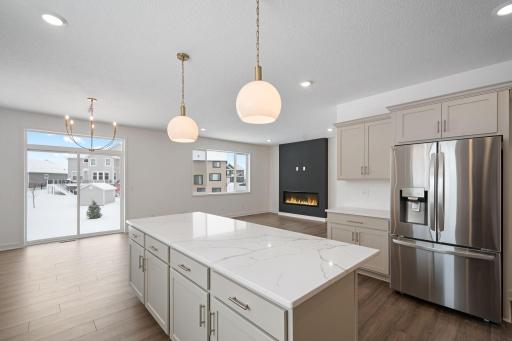 Kitchen overlooks eating area and family room