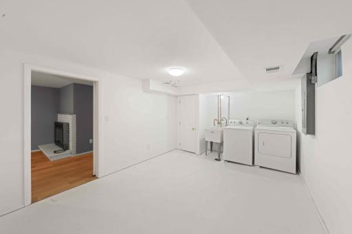 Laundry room in basement with lots of space to add your personal touch