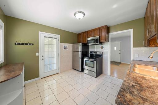 Lots of space to add a breakfast nook or add more cabinets to your liking