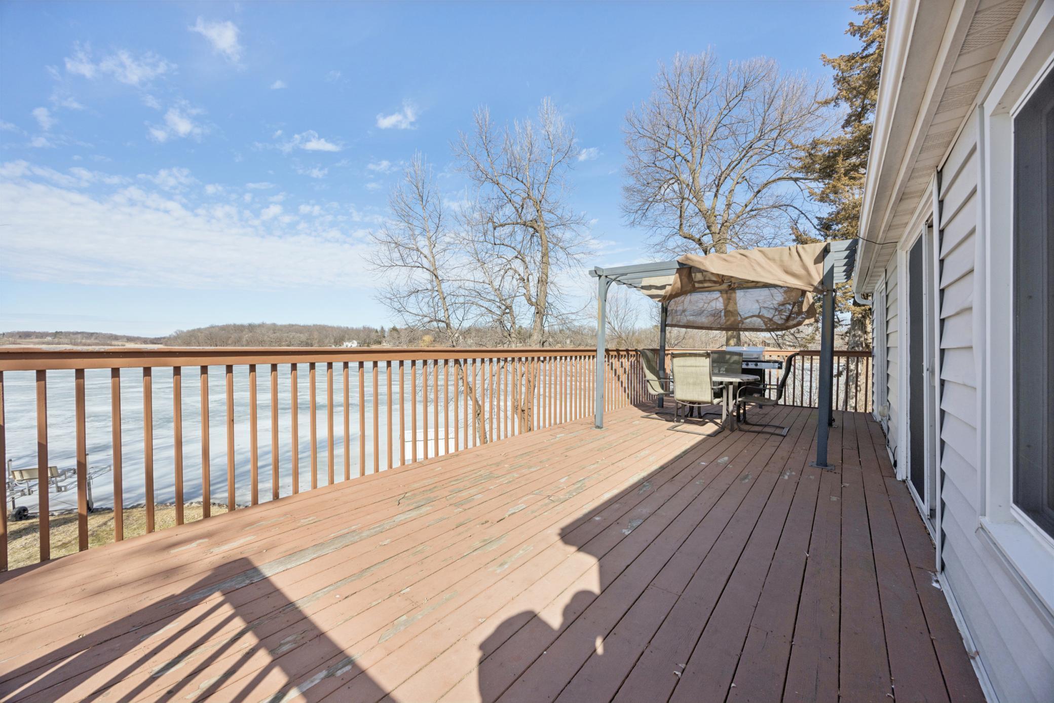 Enjoy seamless indoor-outdoor living with a deck that stretches across the back of the home, accessible from both the living and dining rooms.