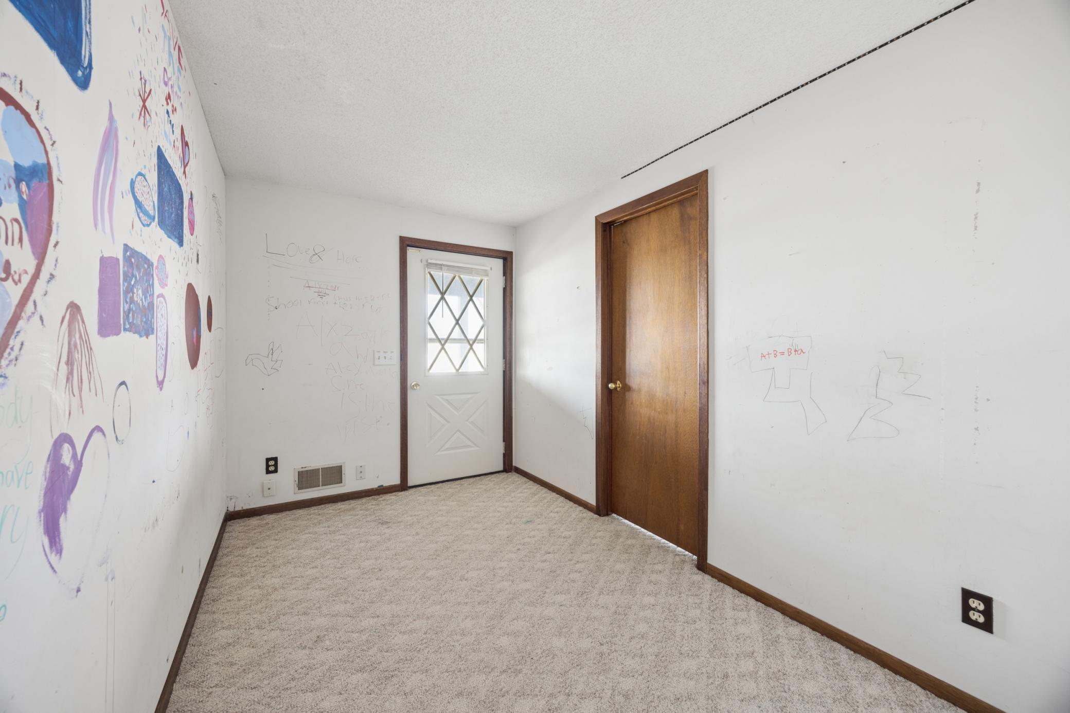 Lower level features two bedrooms overlooking the lake, connected by a breezeway that leads to the walkout patio with beautiful water views.