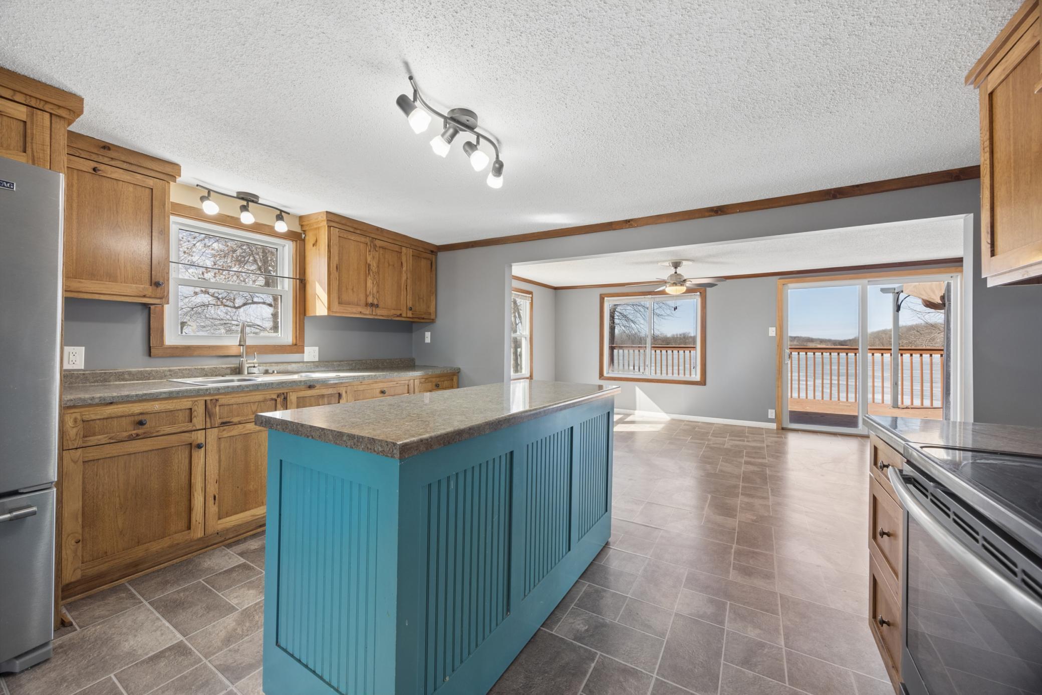 This kitchen combines space and functionality with a cheerful window over the sink.