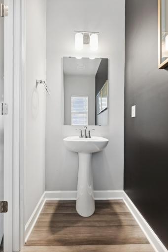 Powder room located near the main level living spaces