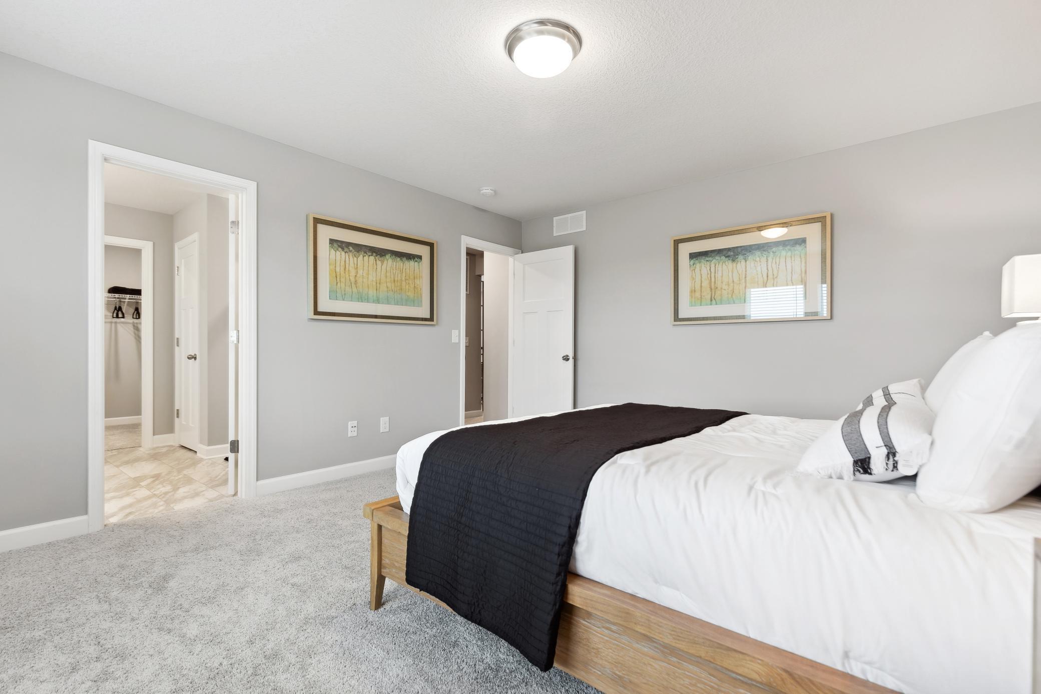 The bedroom has direct access to the private bathroom