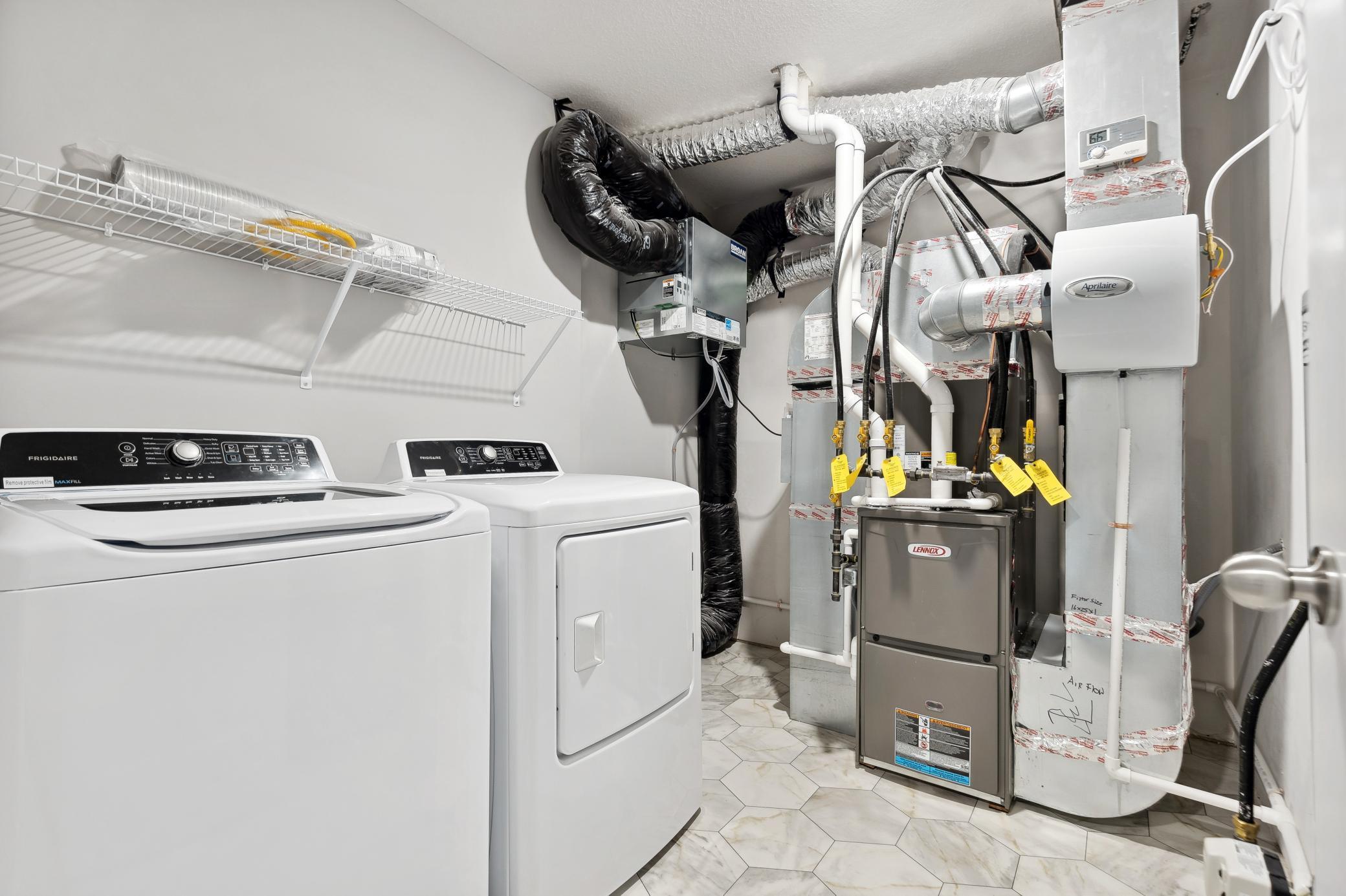 Laundry room with ventilated shelving for your convenience